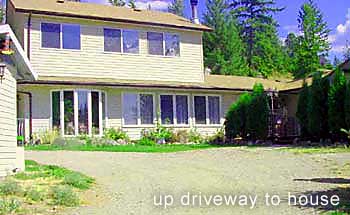 looking up at Kelowna house fr. driveway to mountain views