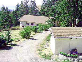 view of pump house and workshop in foreground with some of panoramic Kelowna area view