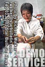 Melissa Yee, acupuncturist in Honolulu featured in HAWAII AT WORK article/photo by Richard Walker at the Star Bulletin Newspaper 2003/02/03