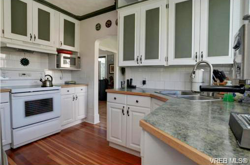 view of Vista Heights house kitchen, note renovated counter tops space and cupbords